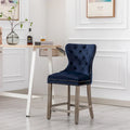 Carter 24-Inch Wingback Tufted Counter Stool with Antique Grey Legs and Nailhead Trim
