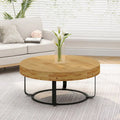 Contemporary Round Wooden Coffee Table with Intricate Carving and Metal Legs
