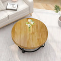 Contemporary Round Wooden Coffee Table with Intricate Carving and Metal Legs